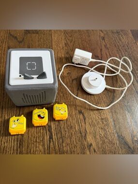Grey Audio Player with White Charger and Joke Story Cartridges
